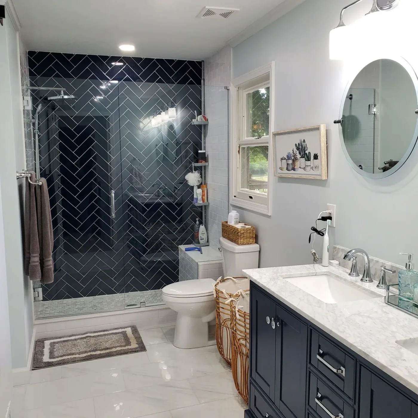 Bathroom remodel with herringbone tile shower